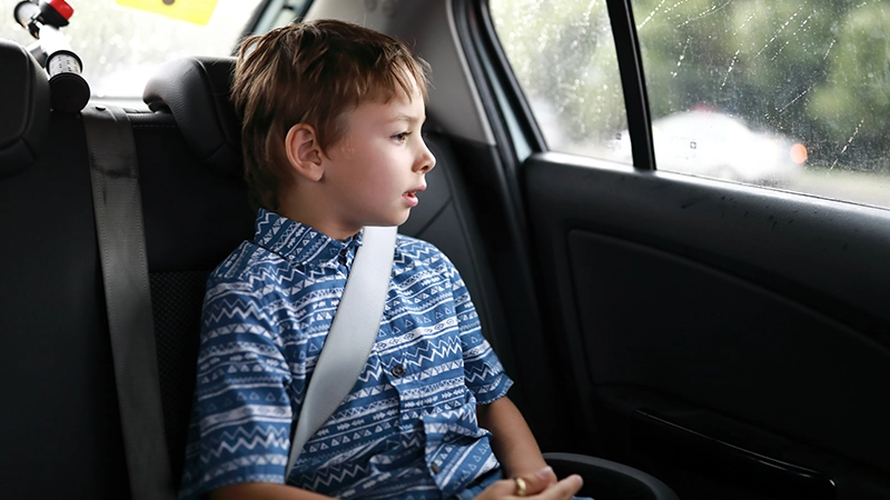 A child sitting in a car.