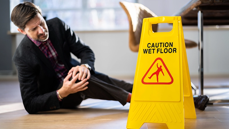 Slip fall accident. Floor sign caution and safety.